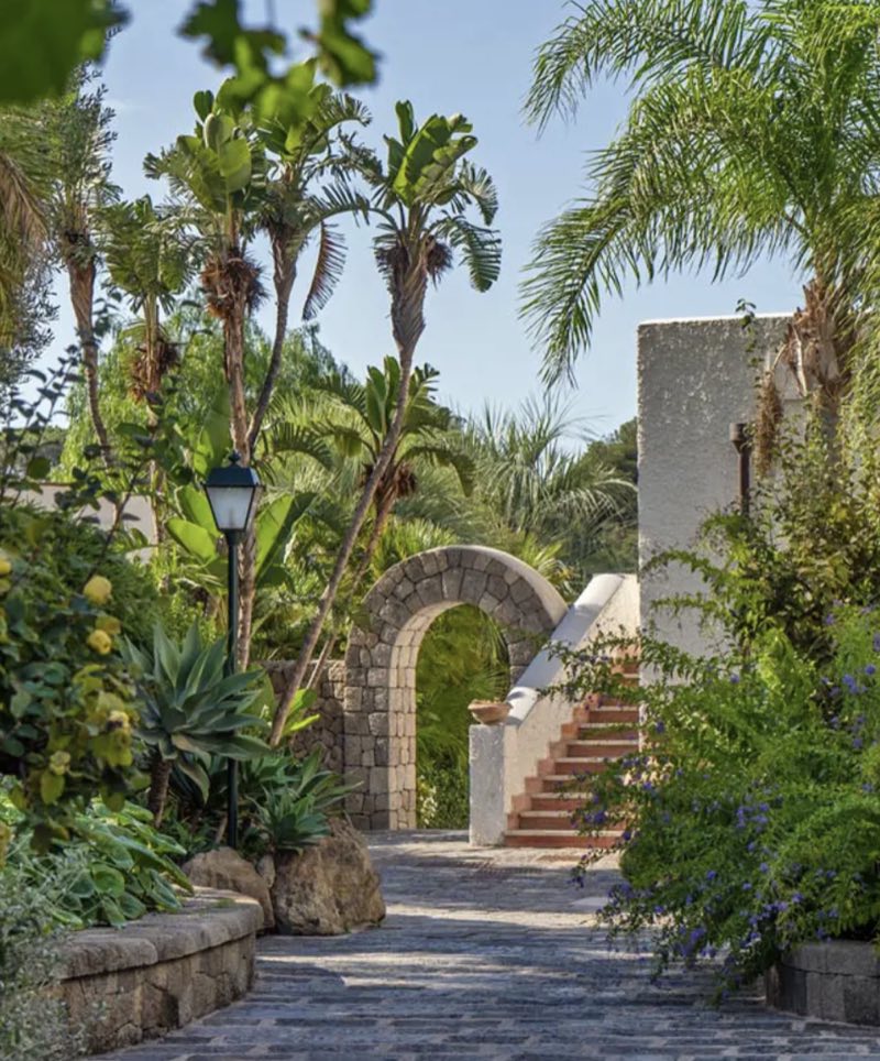 Stone archway and gardens at the hotel entrance