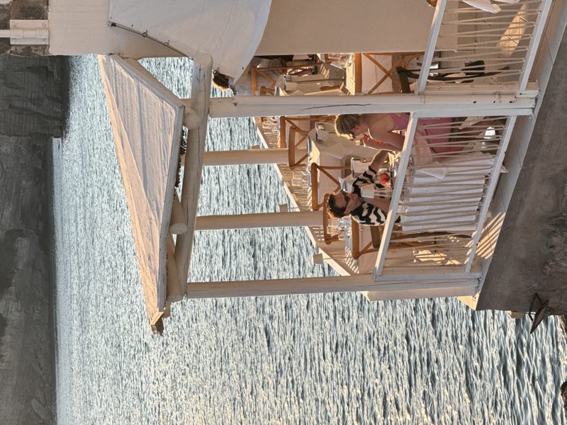 Seaside restaurant terrace on Ischia at sunset