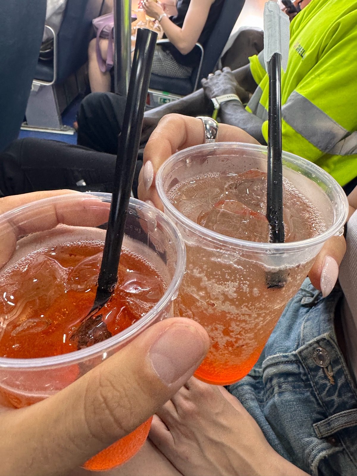 Two spritz in plastic cups, toasting on the hydrofoil