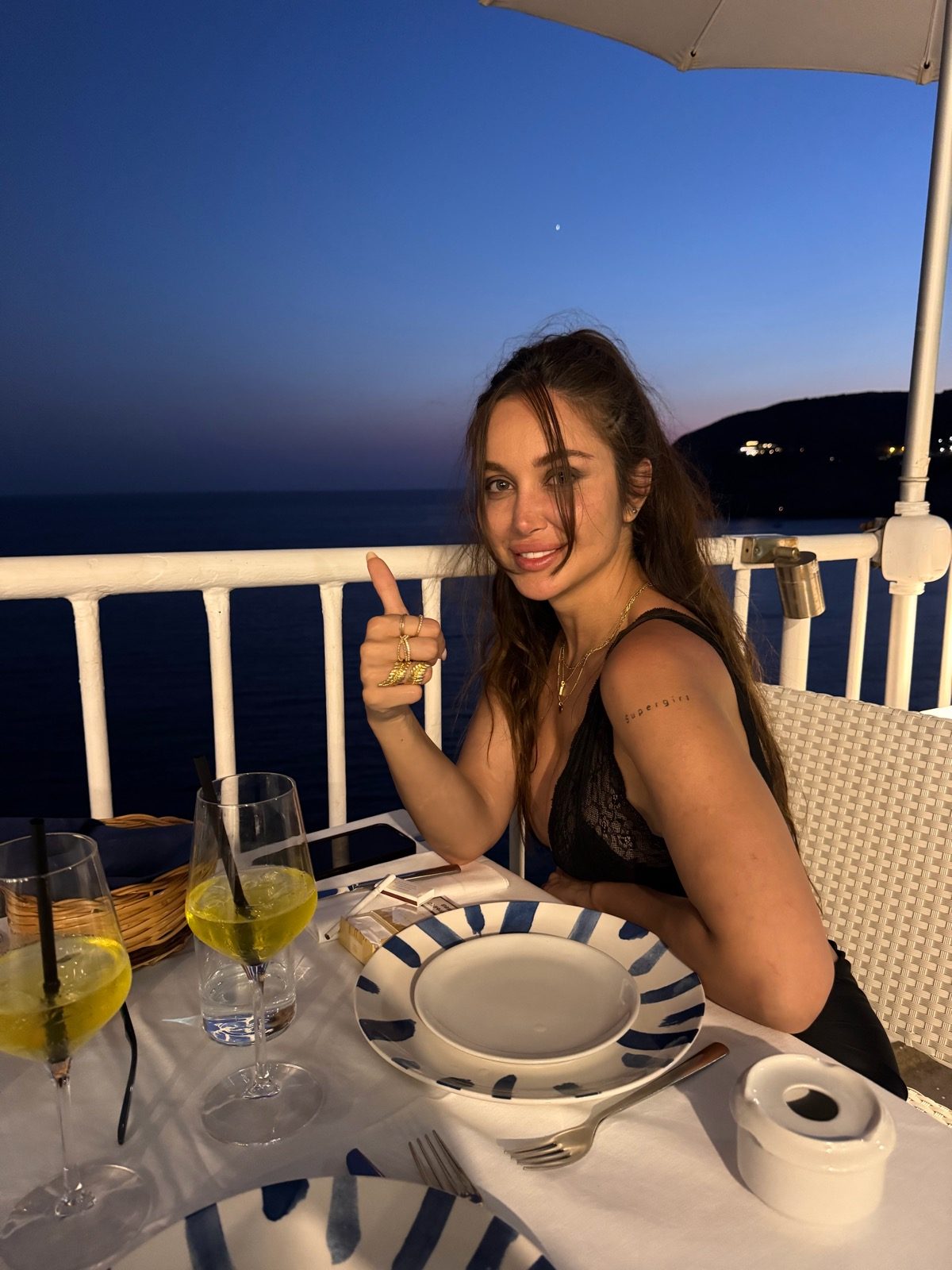 Saba at dinner in Sant'Angelo after dark, thumbs up